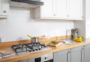 Fully equipped with modern appliances, the kitchen is an absolute delight to cook in.