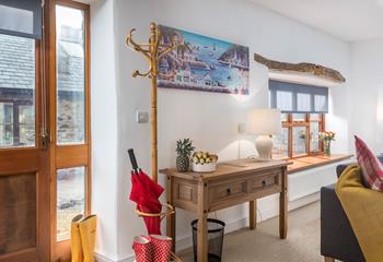 The original feature exposed oak lintel and seaside artwork work perfectly to reflect the close proximity to the sea.