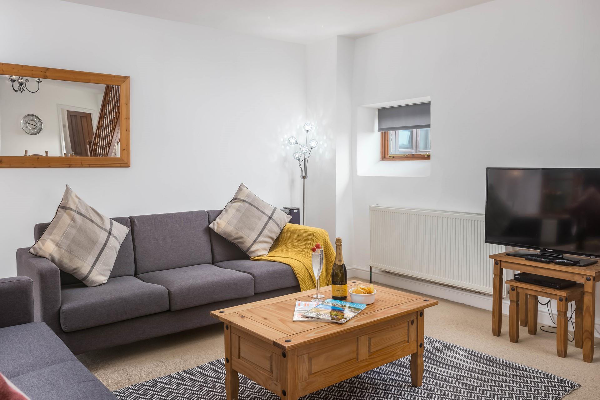 Sink into the comfortable sofa and curl up to watch some TV.