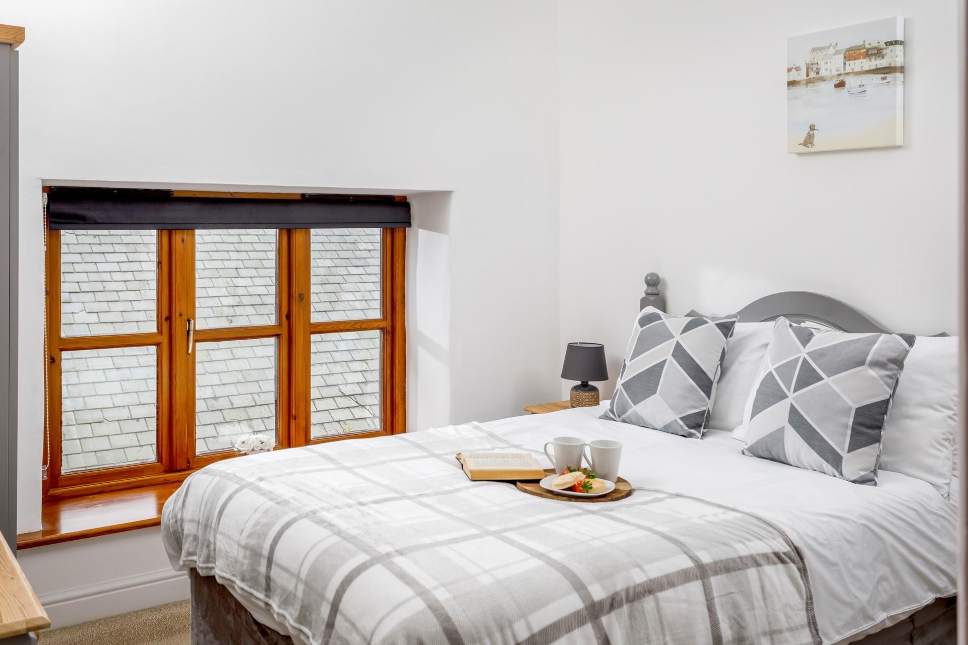 Bedroom 1 has a sumptuous double bed, perfect for sipping your morning cuppa.