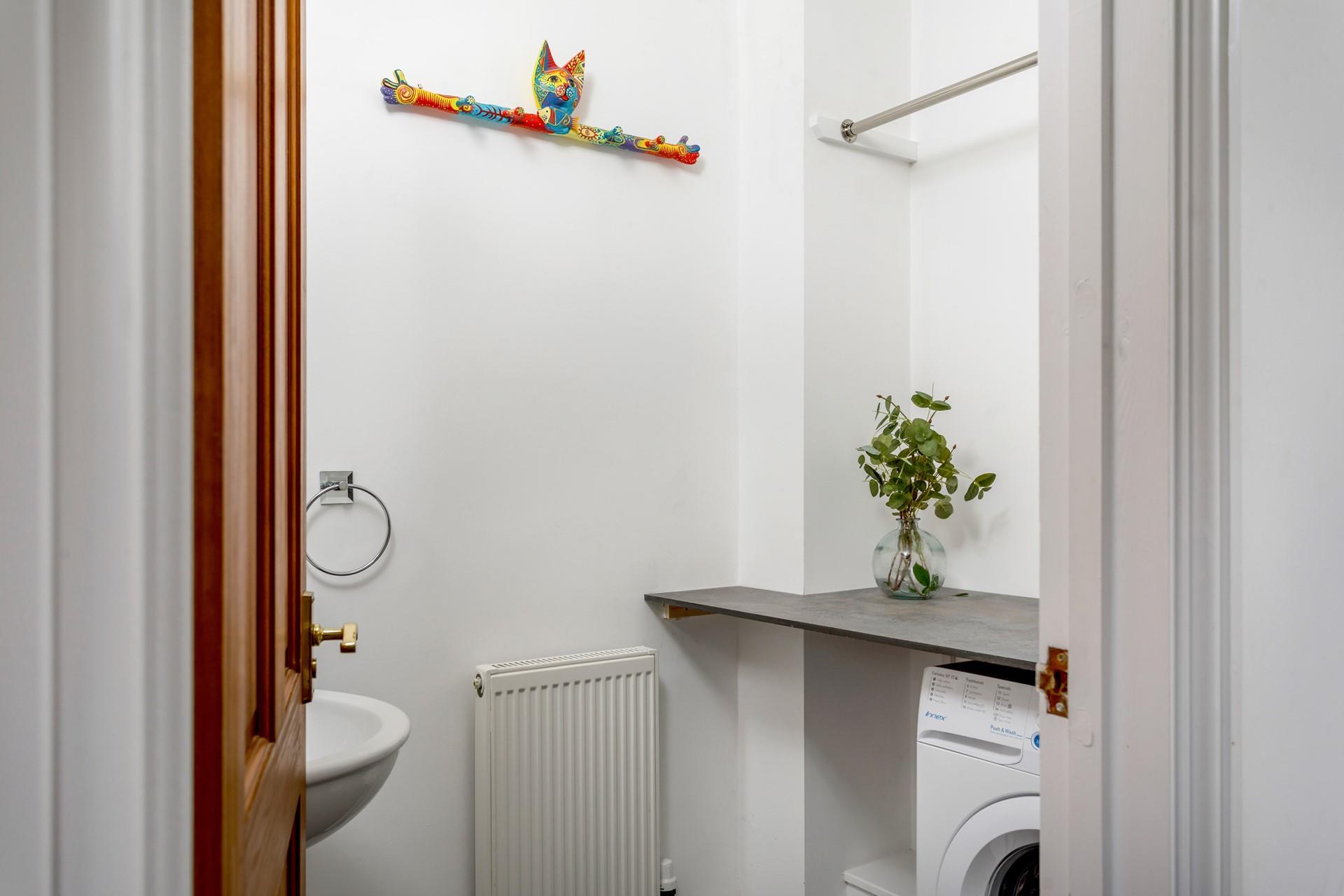 The utility room has a washing machine for washing off your beachwear ready for another day.