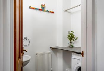 The utility room has a washing machine for washing off your beachwear ready for another day.