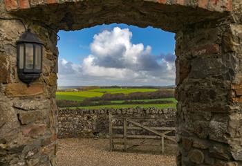 Through the traditional ironstone archway, the view across the valley and far beyond is breathtaking.