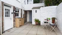 The sweet and pretty courtyard is a delightful space to soak up the last of the day's sun over a glass of wine.