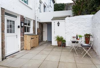 The sweet and pretty courtyard is a delightful space to soak up the last of the day's sun over a glass of wine.