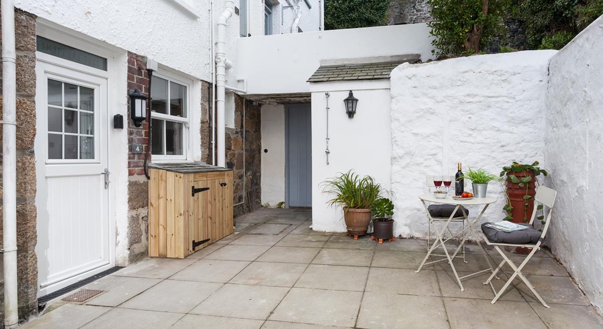 The sweet and pretty courtyard is a delightful space to soak up the last of the day's sun over a glass of wine.