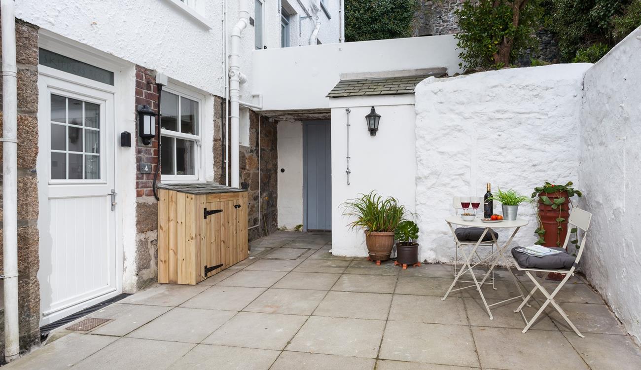 The sweet and pretty courtyard is a delightful space to soak up the last of the day's sun over a glass of wine.