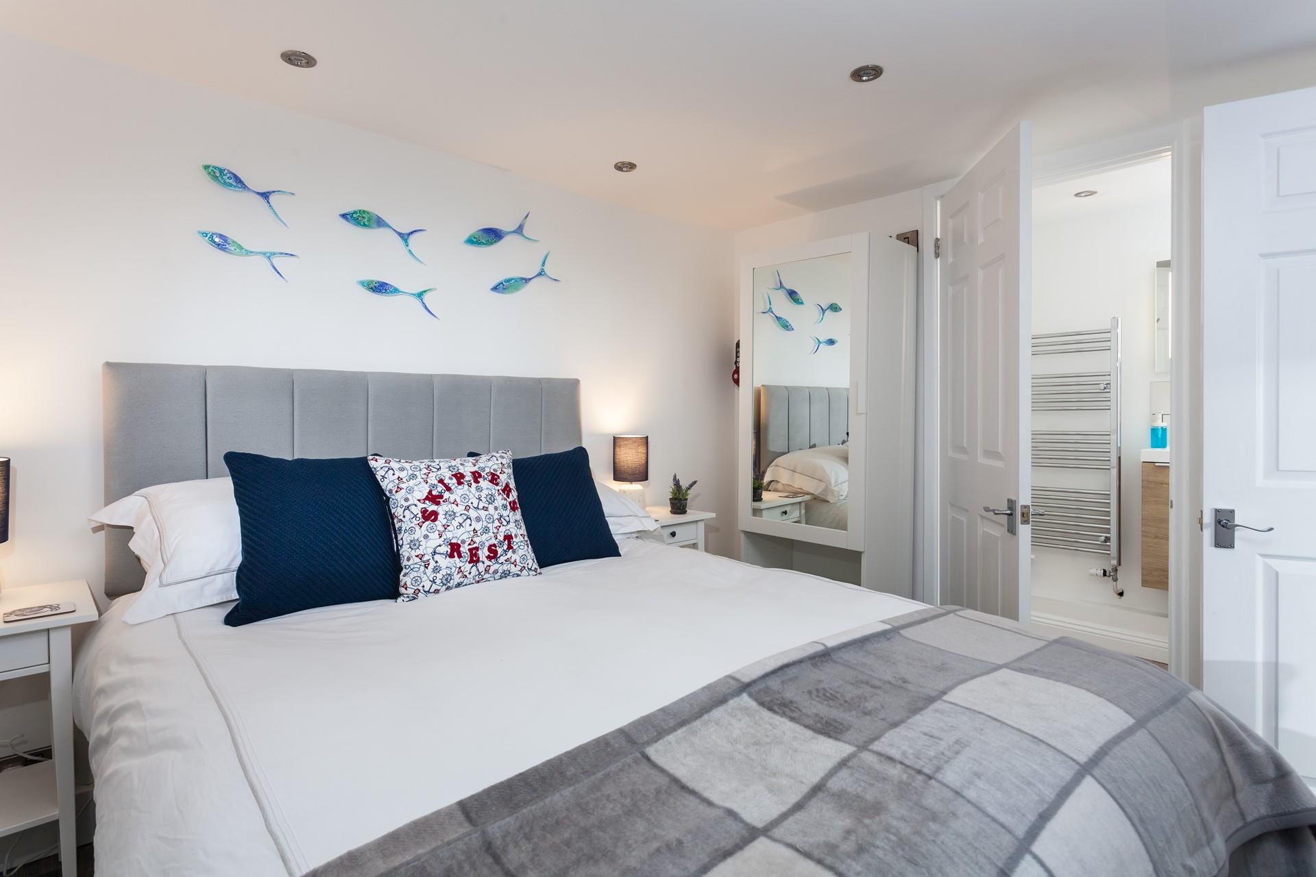 A large comfortable bed and a soothing colour palette ensure a restful night's sleep.