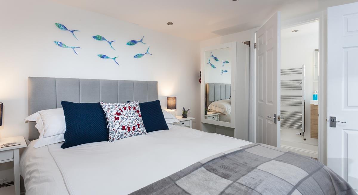 A large comfortable bed and a soothing colour palette ensure a restful night's sleep.