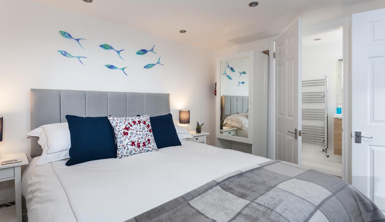 A large comfortable bed and a soothing colour palette ensure a restful night's sleep.