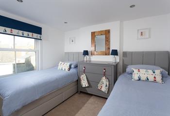 Bedroom 3 has twin beds, perfect for the kids who will be exhausted from a day at the beach.