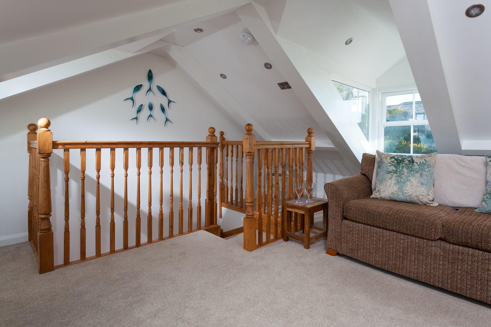 Spend the evening relaxing in the sitting room after a busy day on the beach.