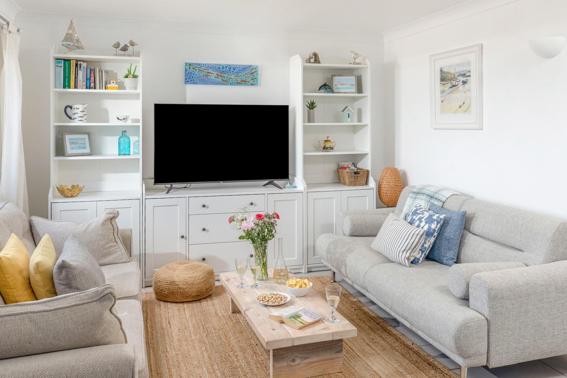 Put on your favourite film and relax on the cosy sofa.