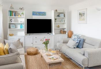 Put on your favourite film and relax on the cosy sofa.
