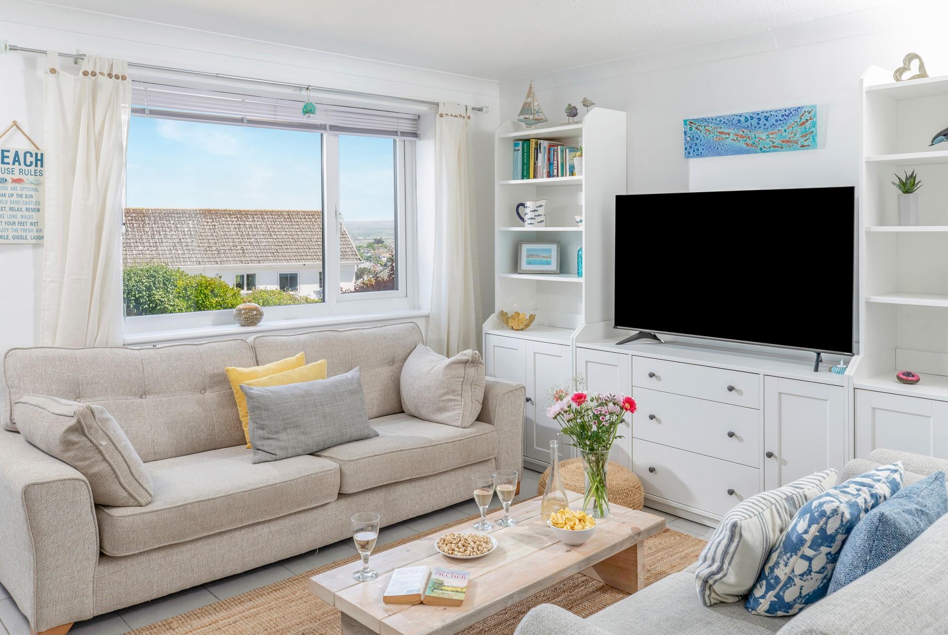Come back to cosy up on the sofa after a day sunbathing on Carbis Bay beach.