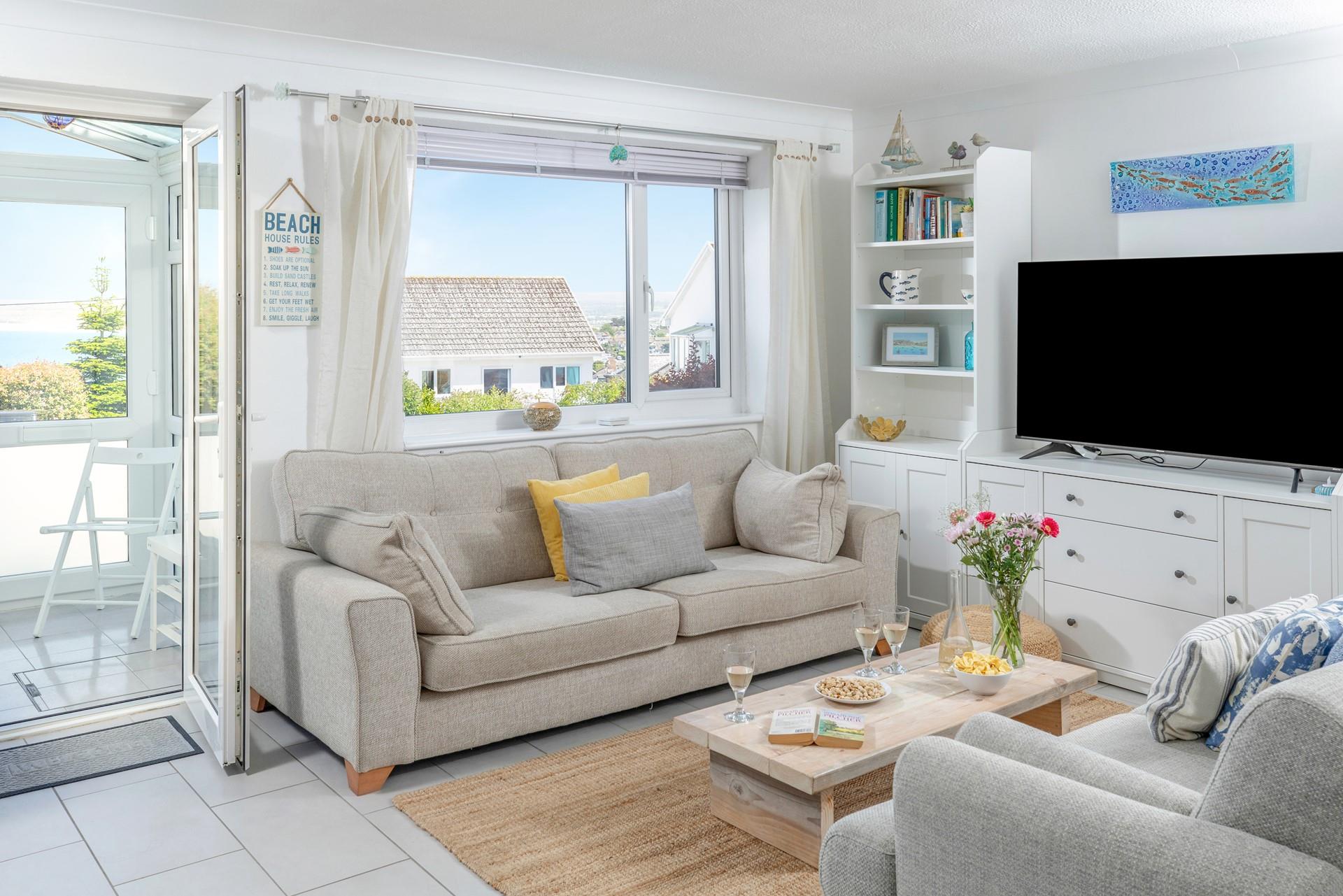 Tuck into some nibbles in the comfortable sitting room.