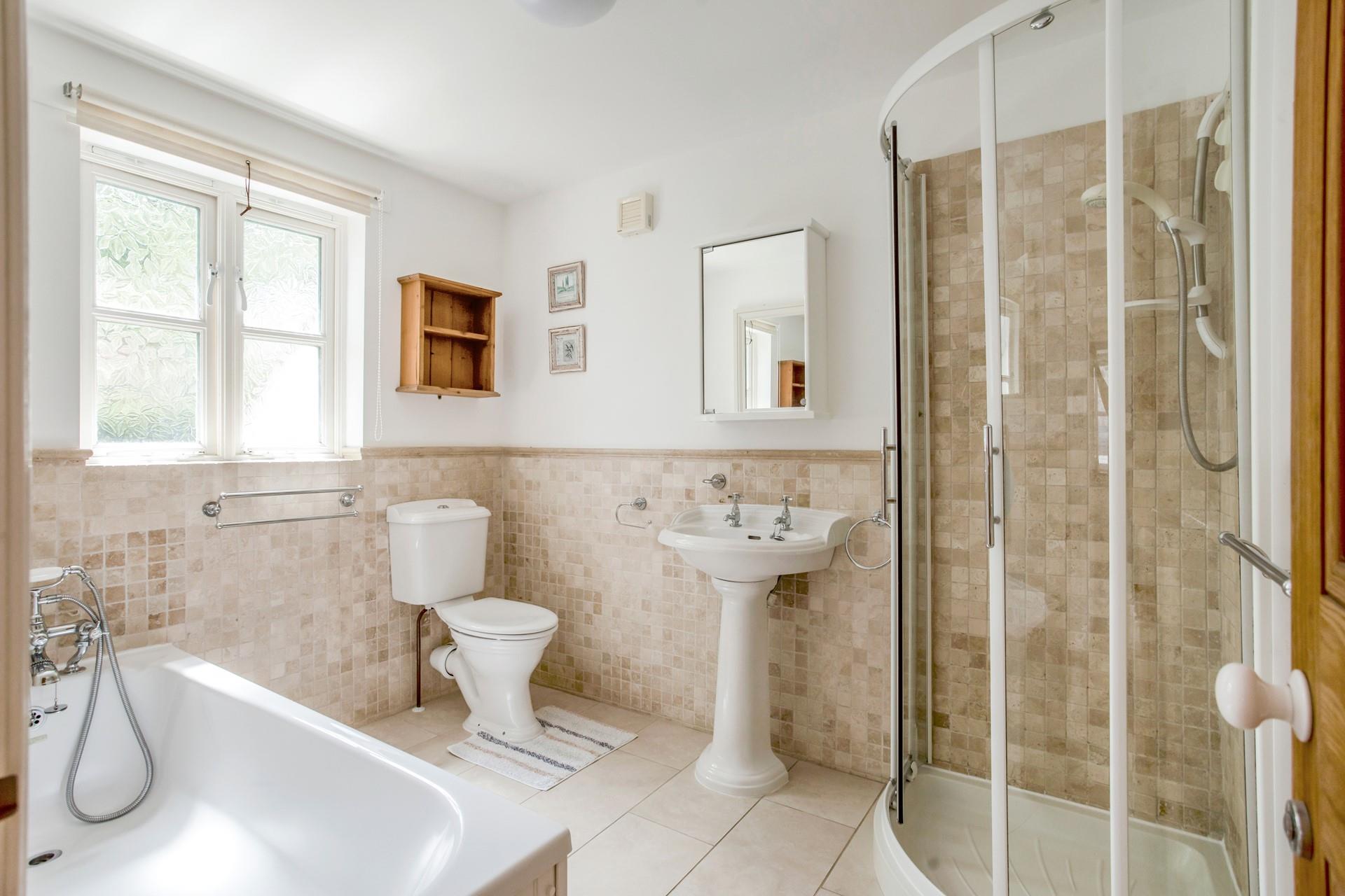 The family bathroom has a free standing bath, separate shower cubicle and is on the first floor. 