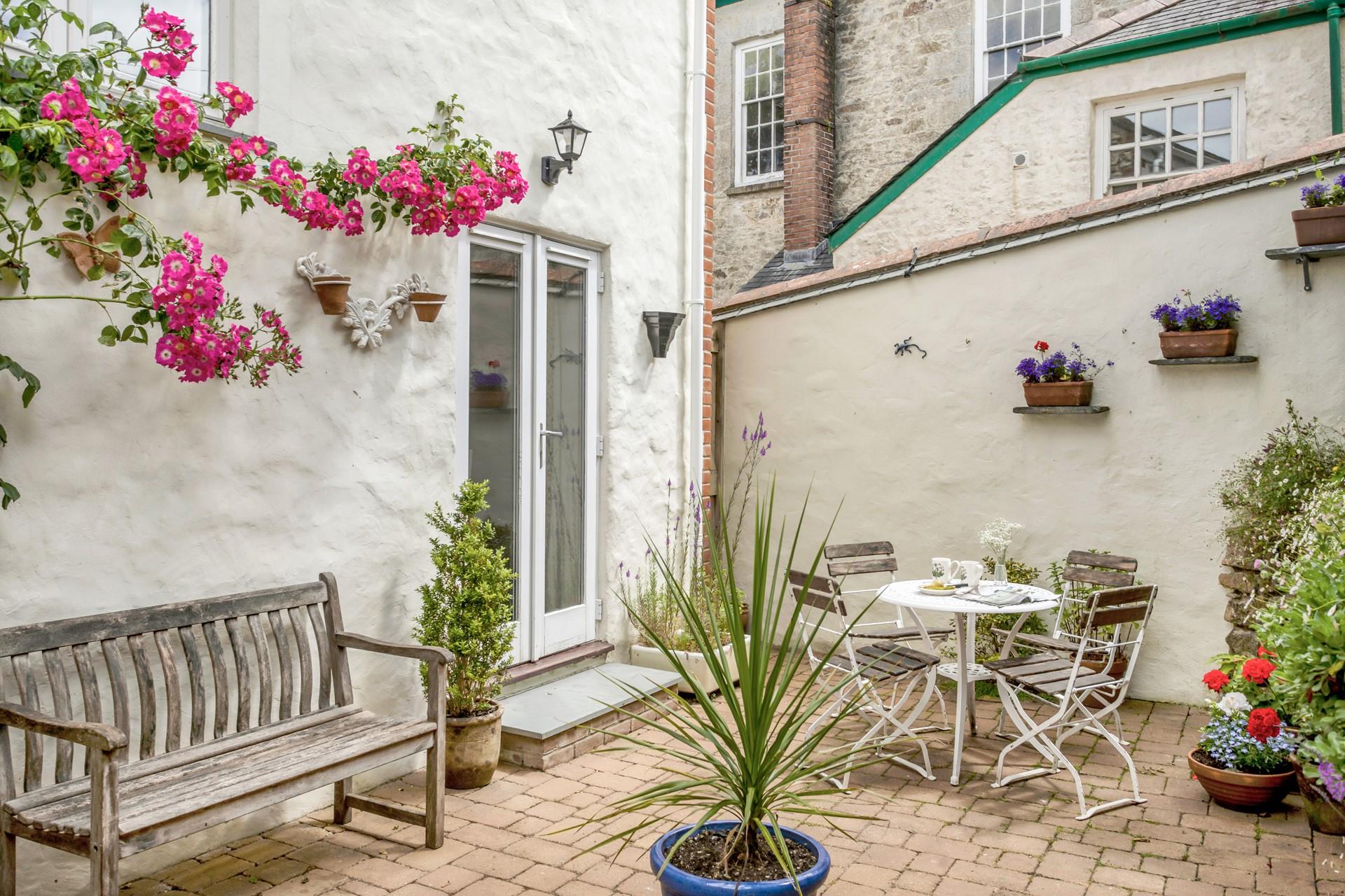 Sip a cup of tea in the suntrap garden in the morning sun.