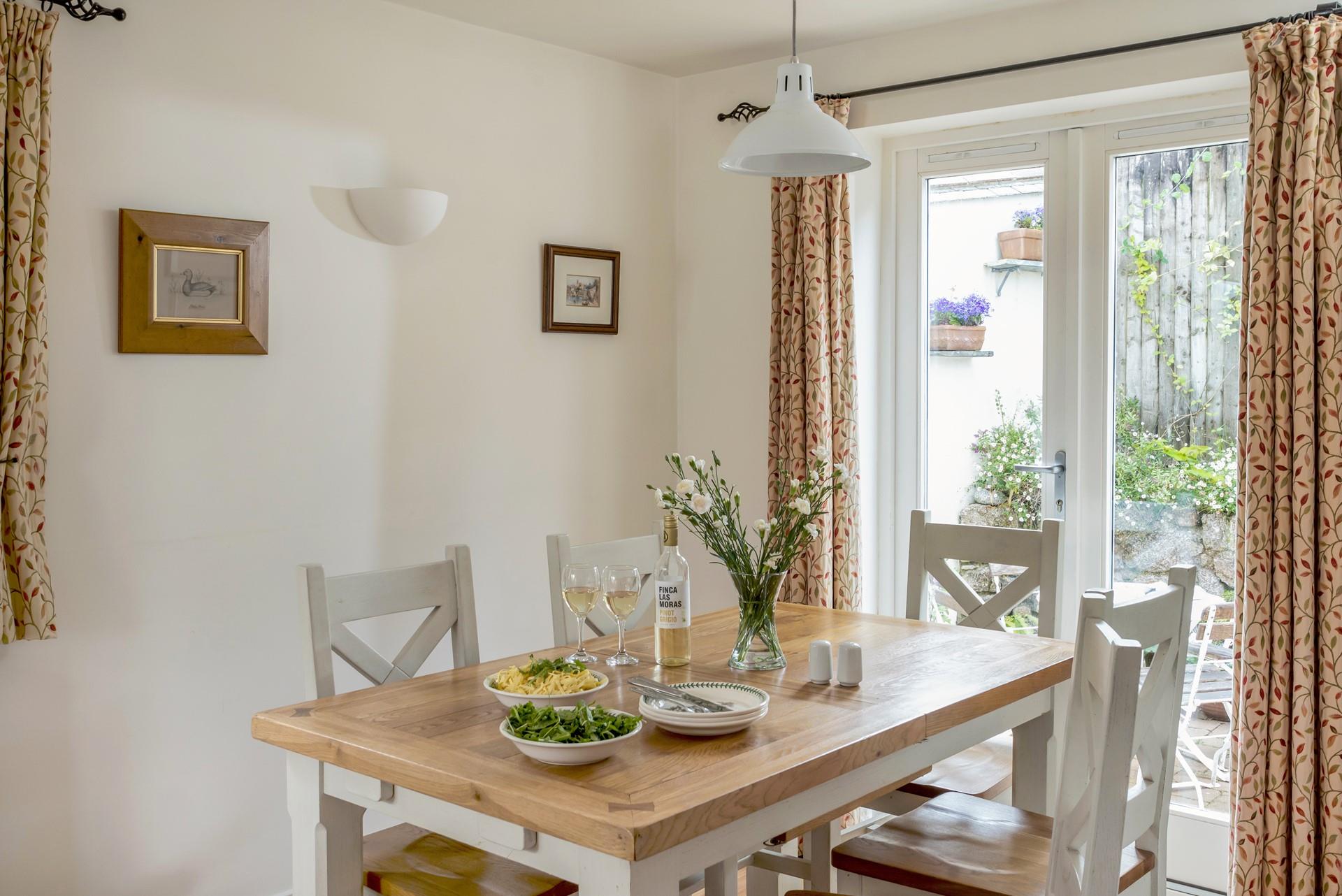 There are doors to the back patio from the dining area, so you can let in a breeze on a hot summer's day. 