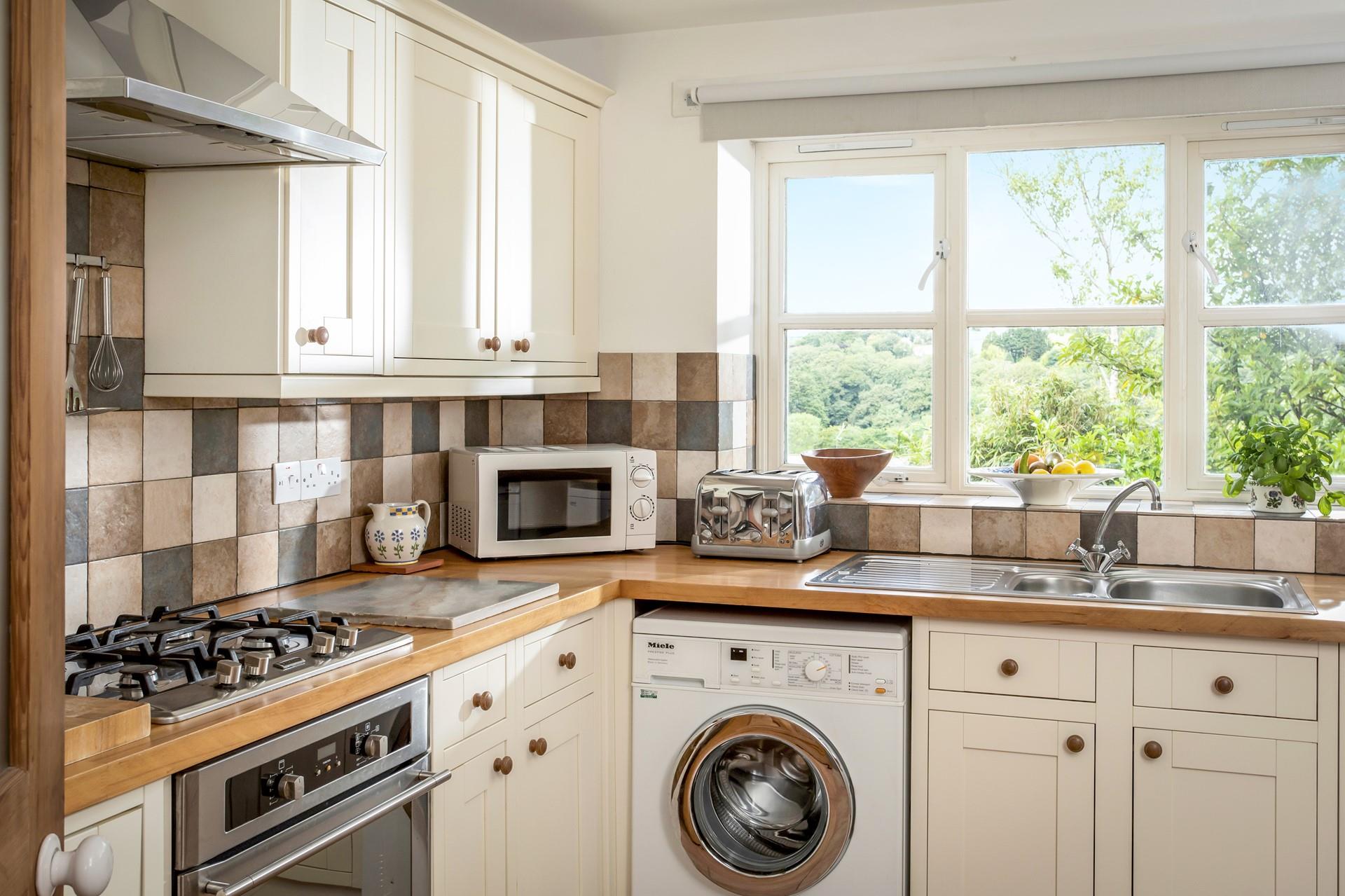 The kitchens charming style and modern appliances make it a joy to cook in.
