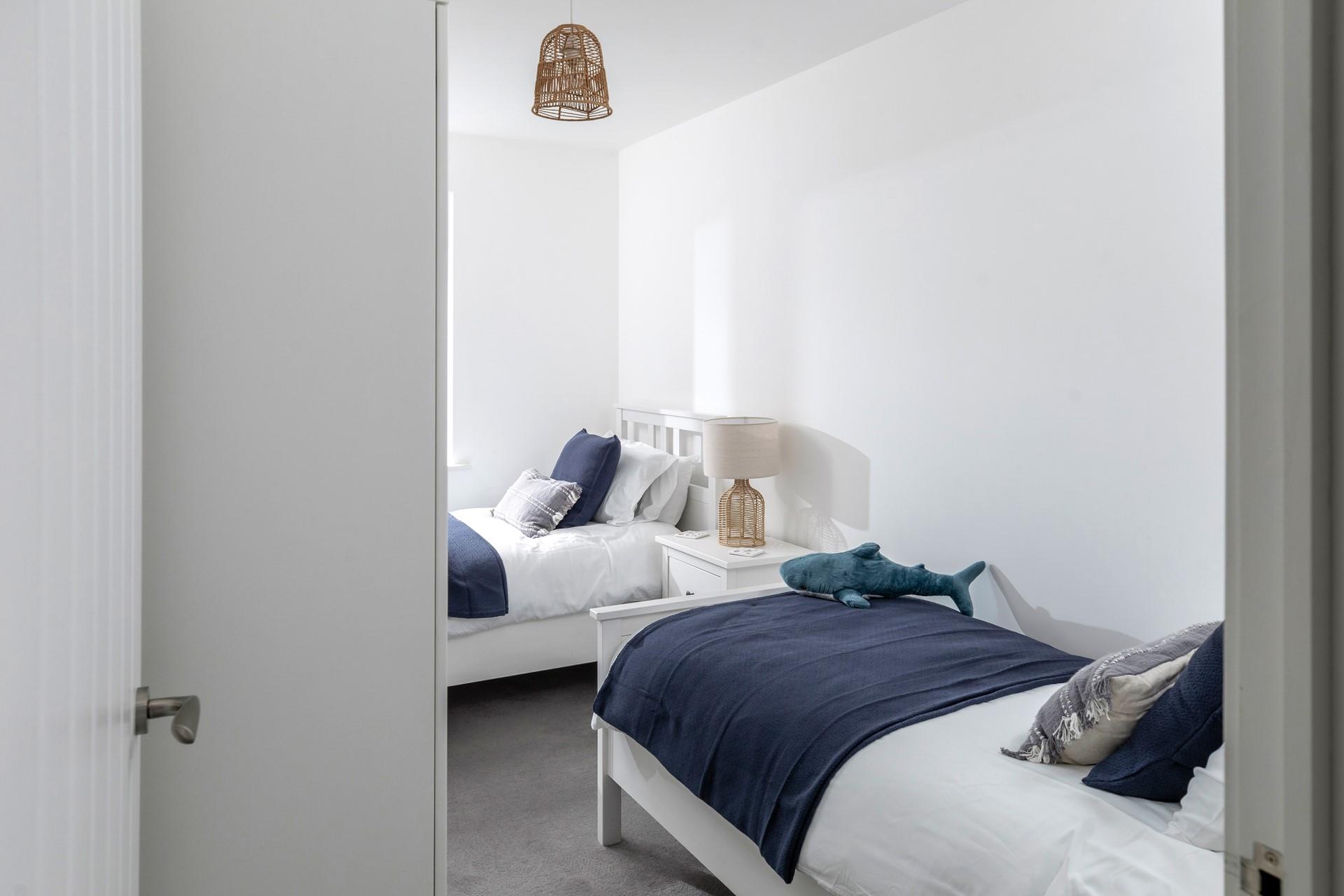 The twin bedroom offers flexible sleeping arrangements whether you're holidaying with friends or family.