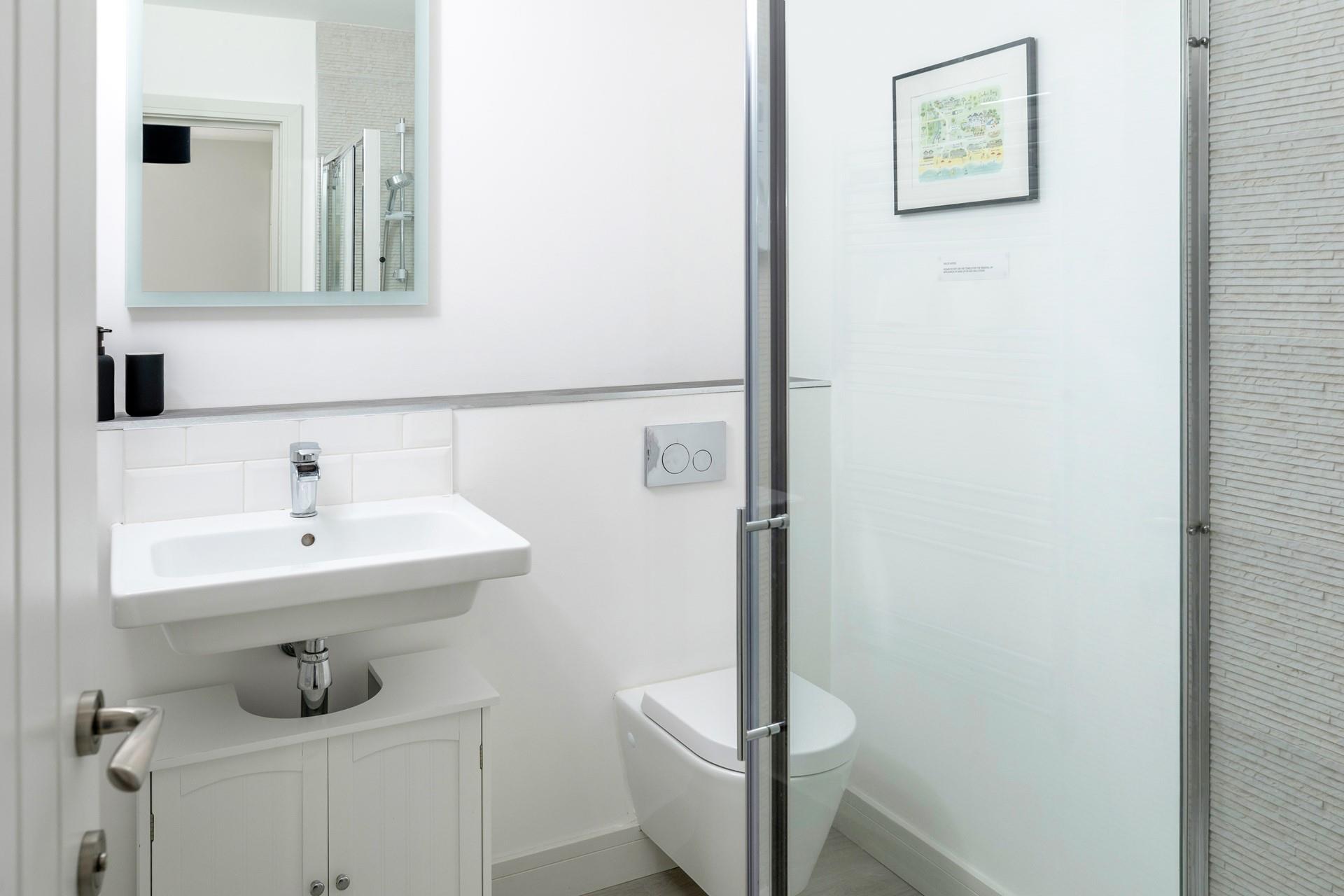 The en suite is sleek and modern.