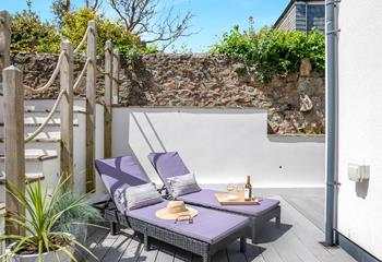 The split level courtyard is a tranquil spot, with loungers for relaxing in the sunshine.