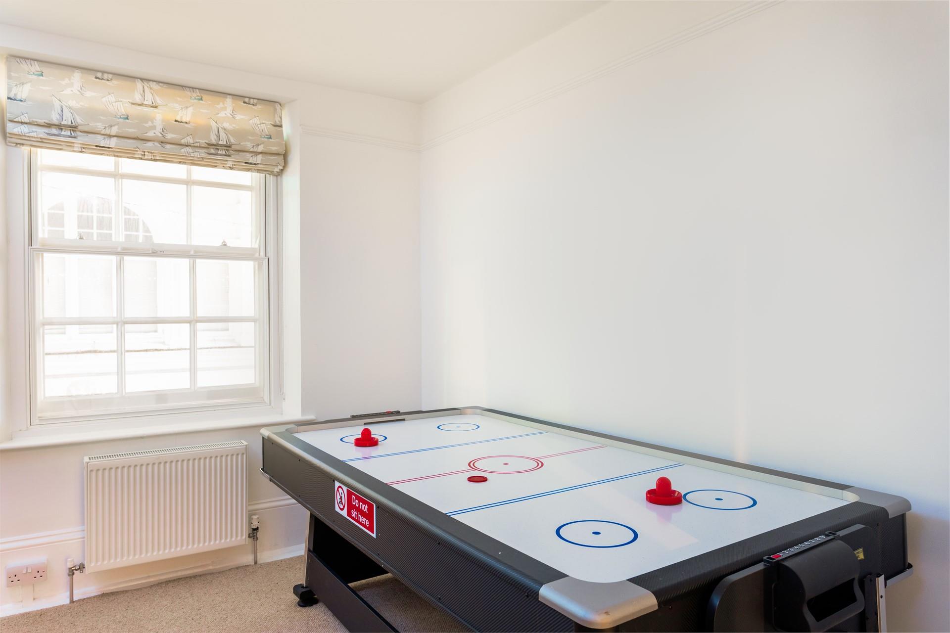 Keep the kids entertained at the air hockey table while dinner is being cooked!