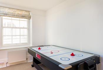 Keep the kids entertained at the air hockey table while dinner is being cooked!