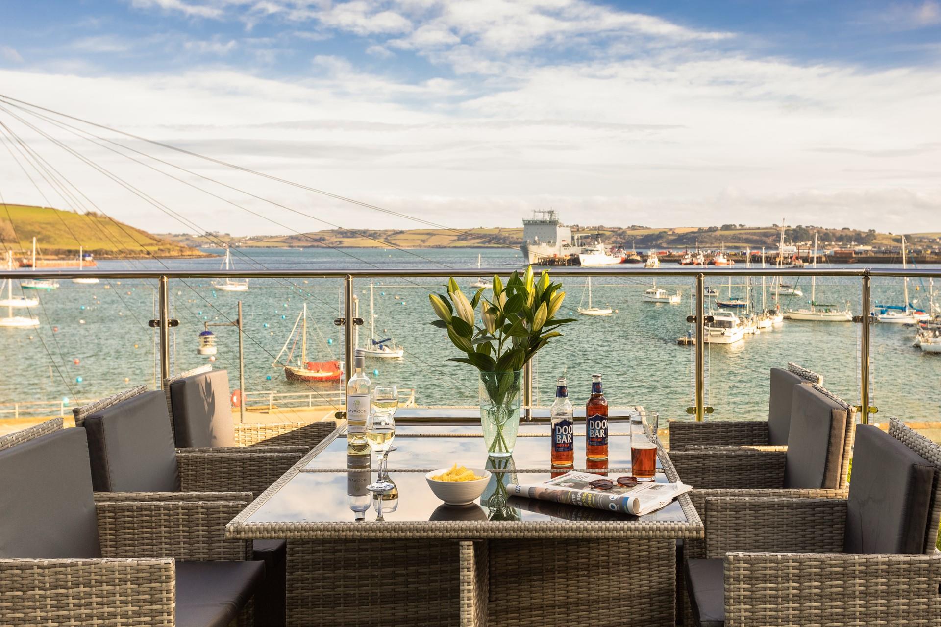 Spend summer evenings soaking up the last of the sun whilst watching the boats bobbing on the water.