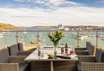 Spend summer evenings soaking up the last of the sun whilst watching the boats bobbing on the water.