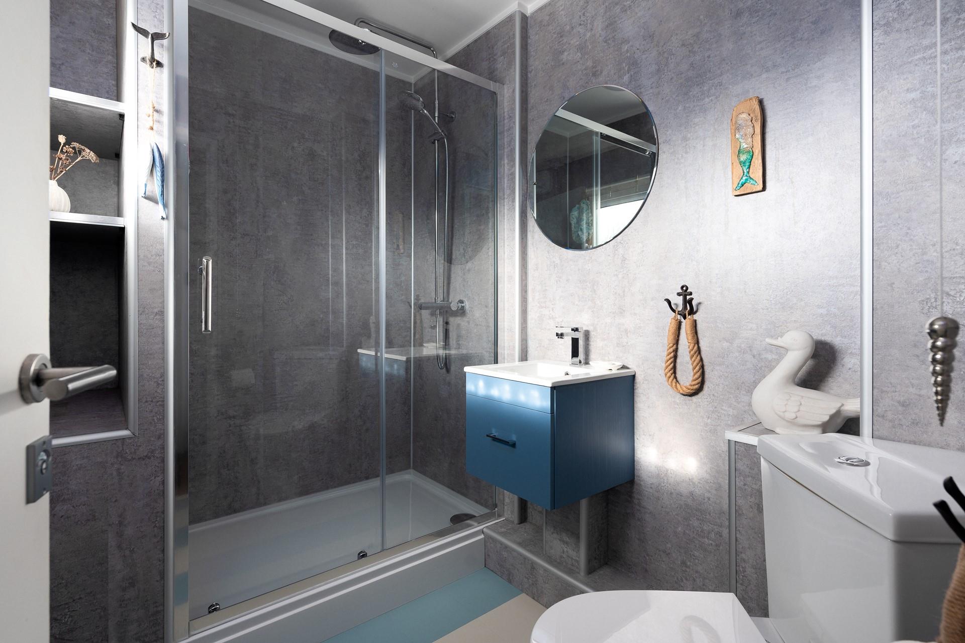 After a busy day exploring Carbis Bay and St Ives, enjoy a relaxing bath in the stylish bathroom; greys and whites create a calming oasis.