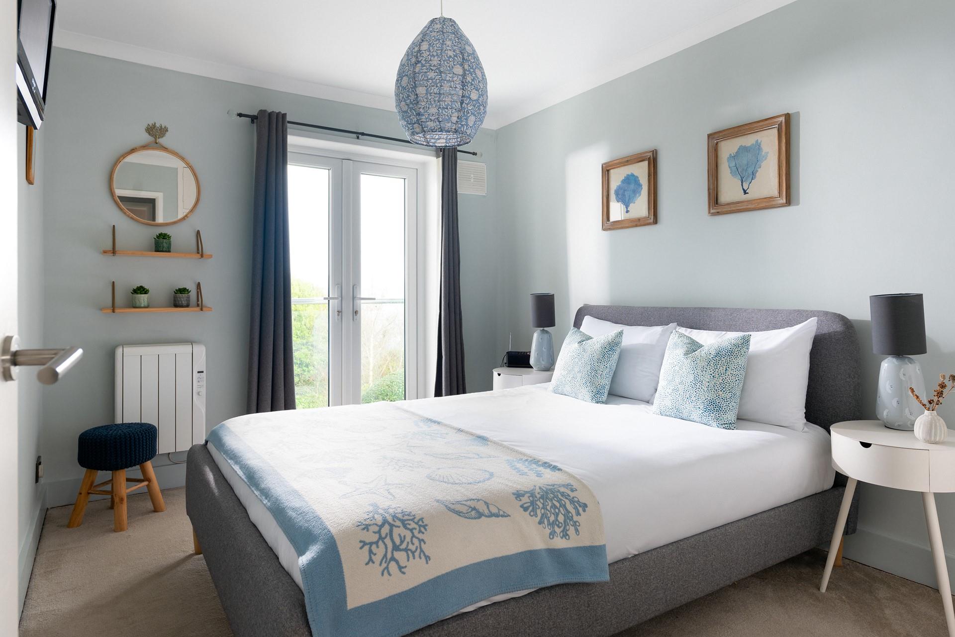 Beautifully furnished, the main bedroom has been thoughtfully designed with luxury and comfort in mind, and benefits from a private balcony.