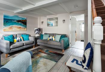 Surprisingly bright and spacious for an old fisherman's cottage, the sitting room is inviting and relaxing. 