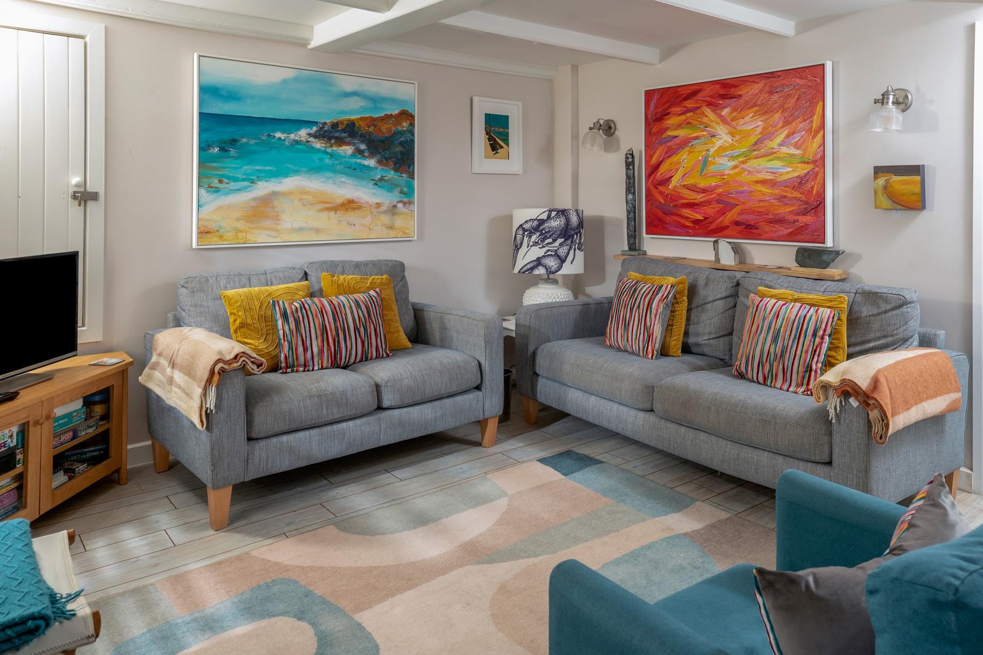 The sitting room perfectly combines traditional features with modern and colourful decor.