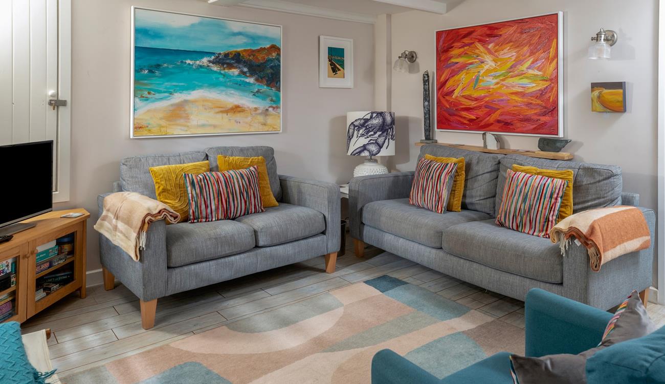 The sitting room perfectly combines traditional features with modern and colourful decor.