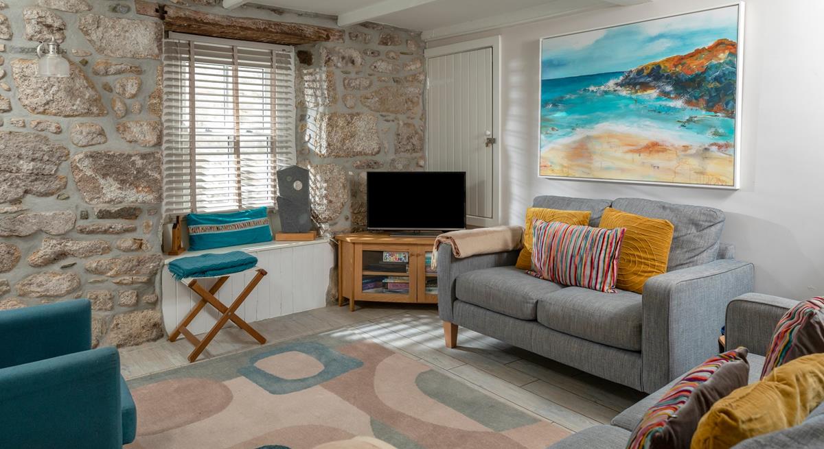 Surprisingly bright and spacious for an old fisherman's cottage, the sitting room is inviting and relaxing.
