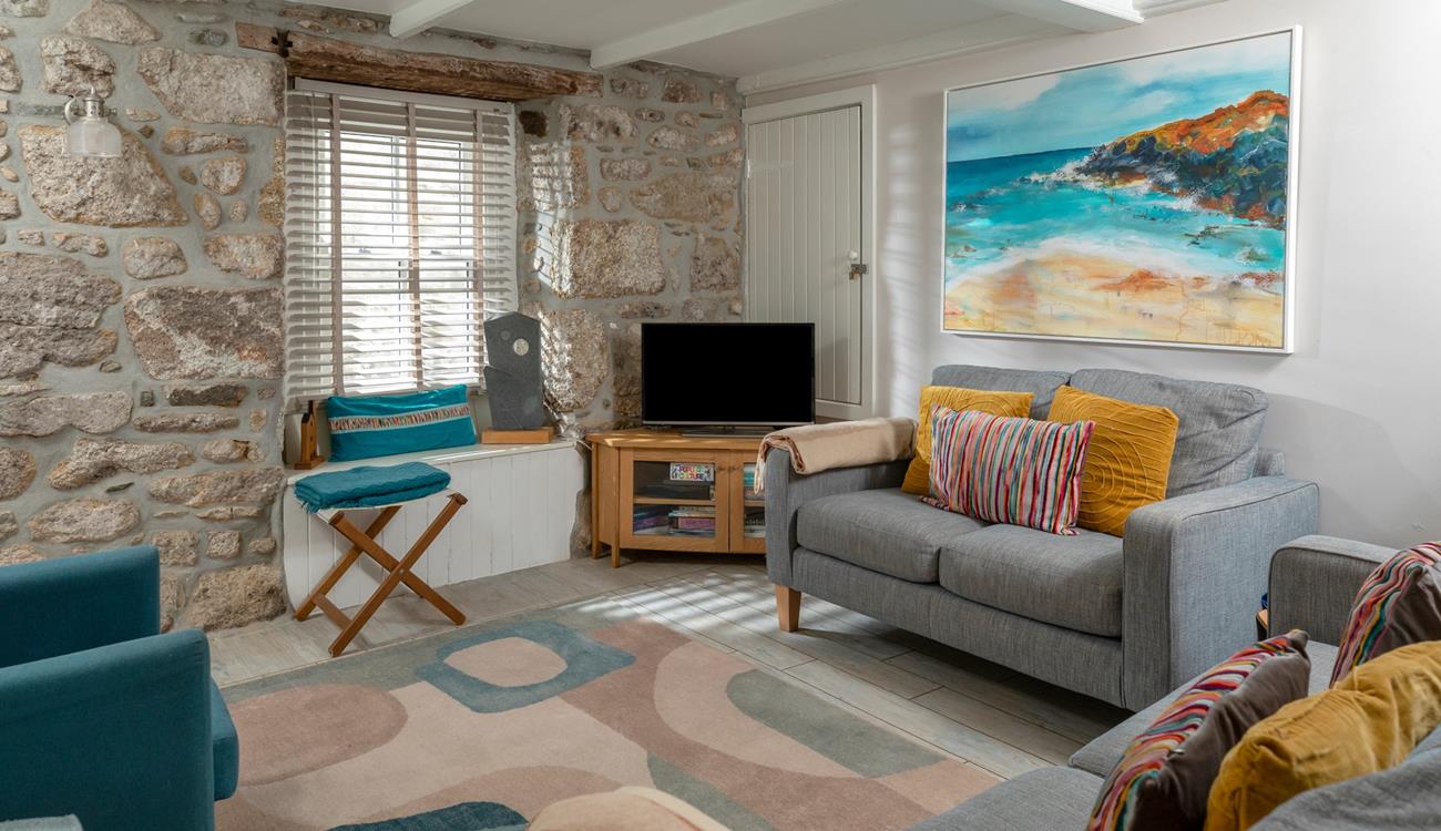 Surprisingly bright and spacious for an old fisherman's cottage, the sitting room is inviting and relaxing.