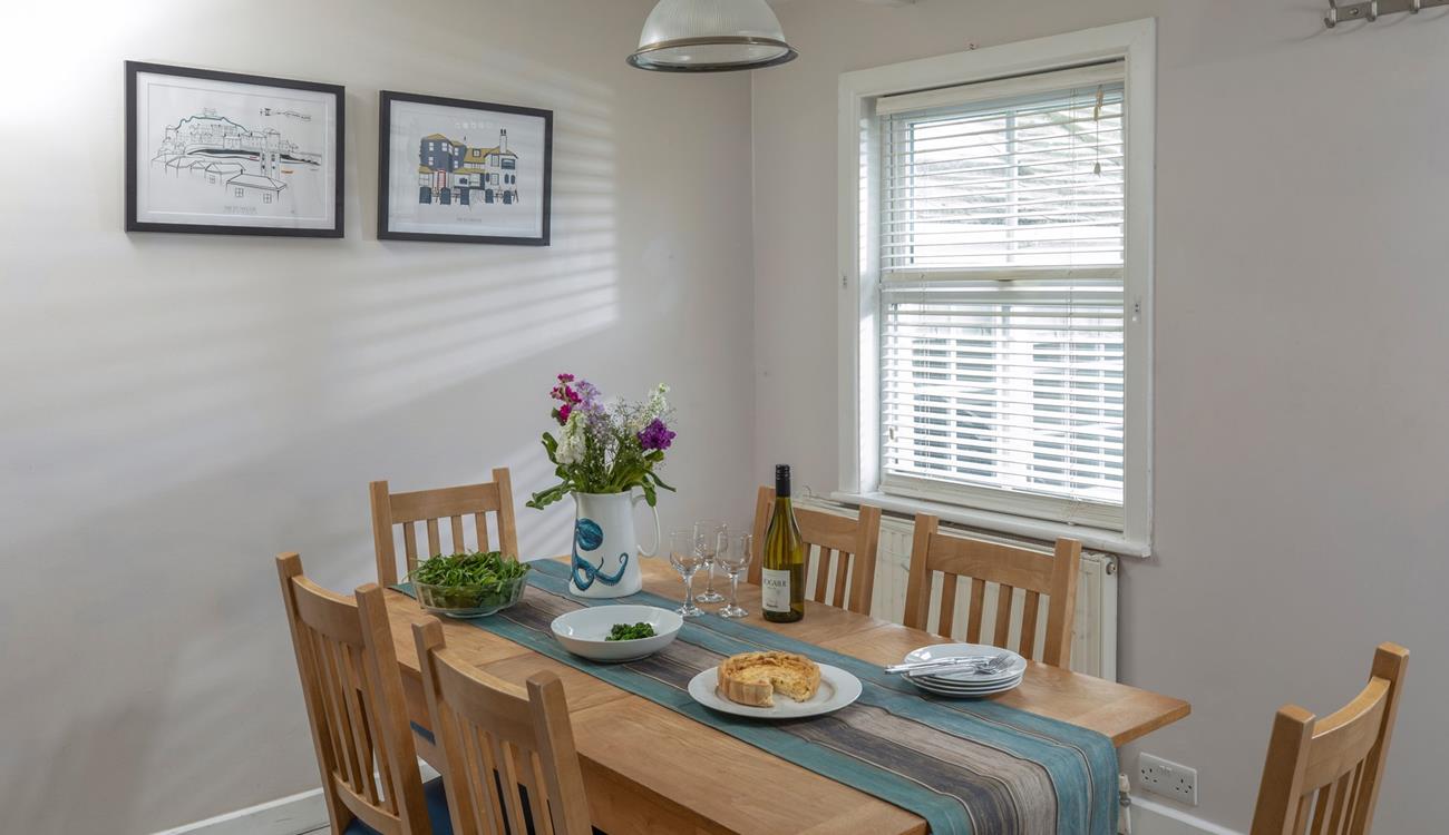 Gather together at the dining table to enjoy an afternoon treat before heading back to the beach!