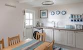 The kitchen has been finished to a high standard, with stylish lighting and Cornish artwork.  - Thumbnail Image