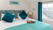 Sink into the sumptuous super king size bed for a blissful night's sleep. 