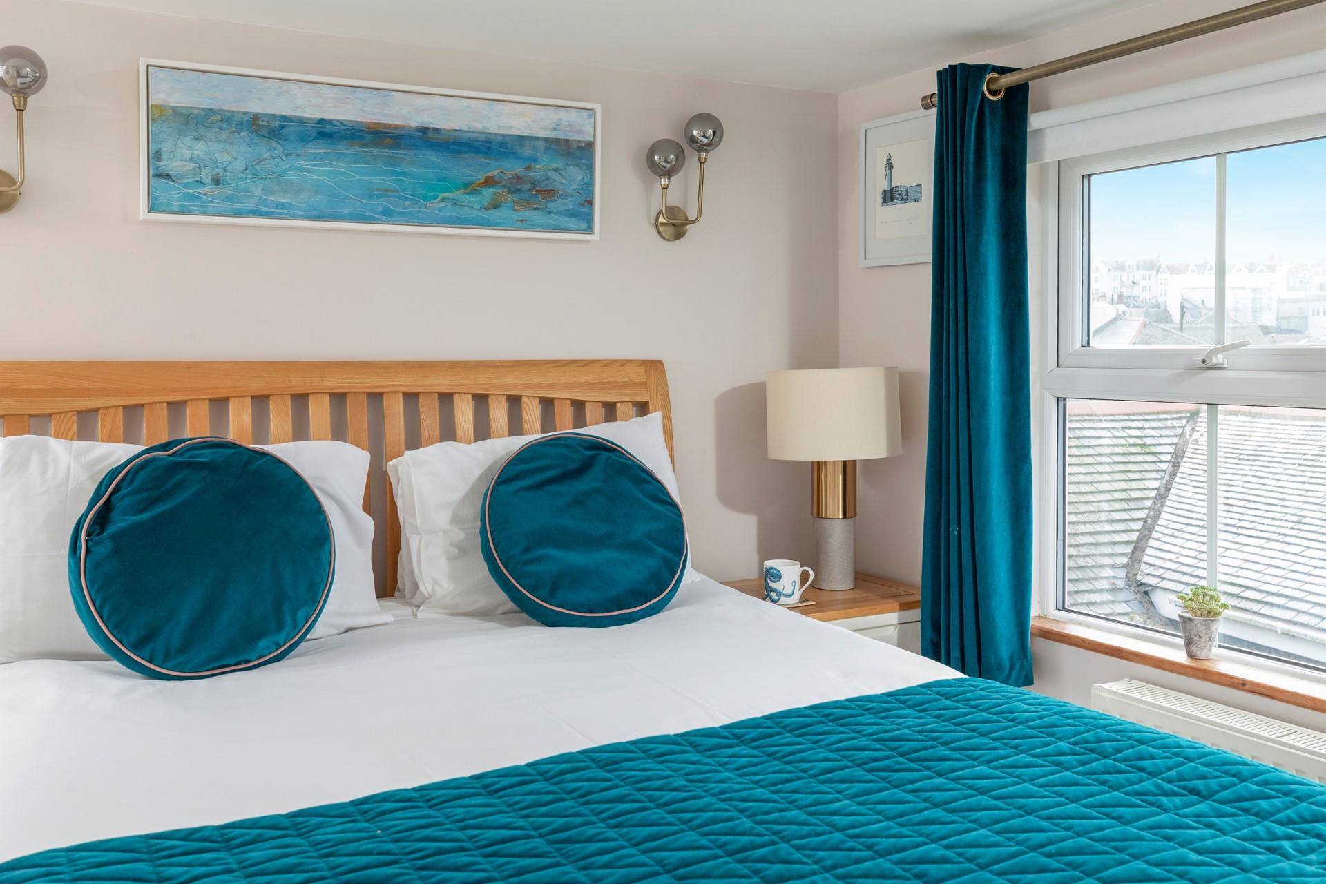 Spend a lazy morning in the king size bed, enjoying views out of the dual windows.