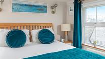Spend a lazy morning in the king size bed, enjoying views out of the dual windows.