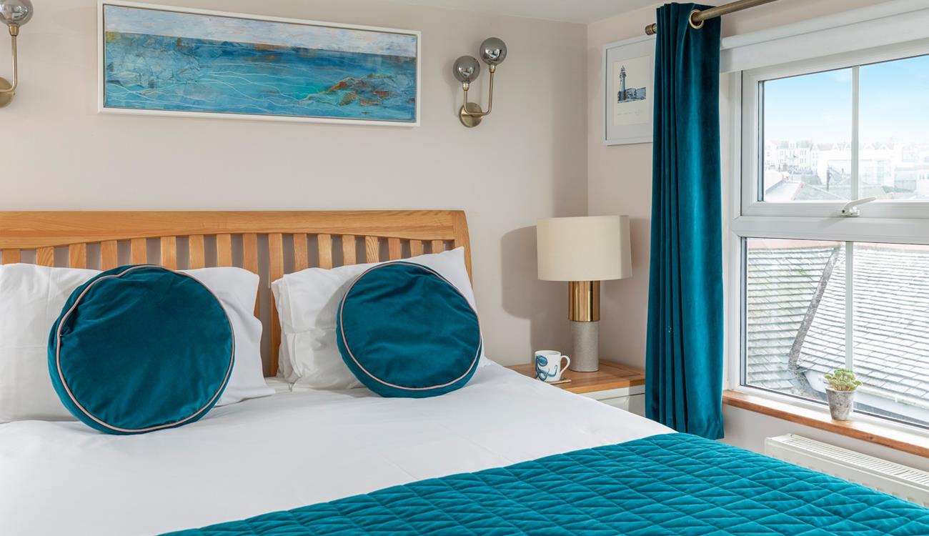 Spend a lazy morning in the king size bed, enjoying views out of the dual windows.