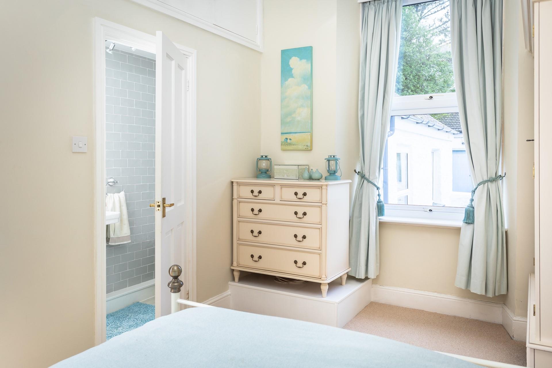 Bedroom 1 has a spacious king size bed and an en suite to get ready in the morning.