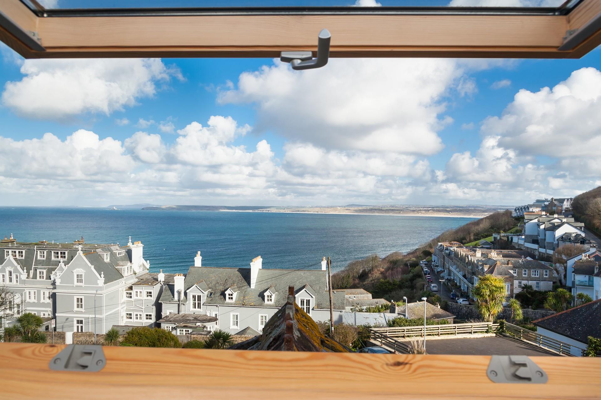 Bedroom 2 has far-reaching sea views across St Ives Bay.