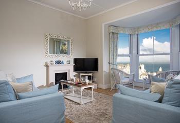 Relax in the sitting room, looking out over the views in the summer or in front of the fire in the colder months. 