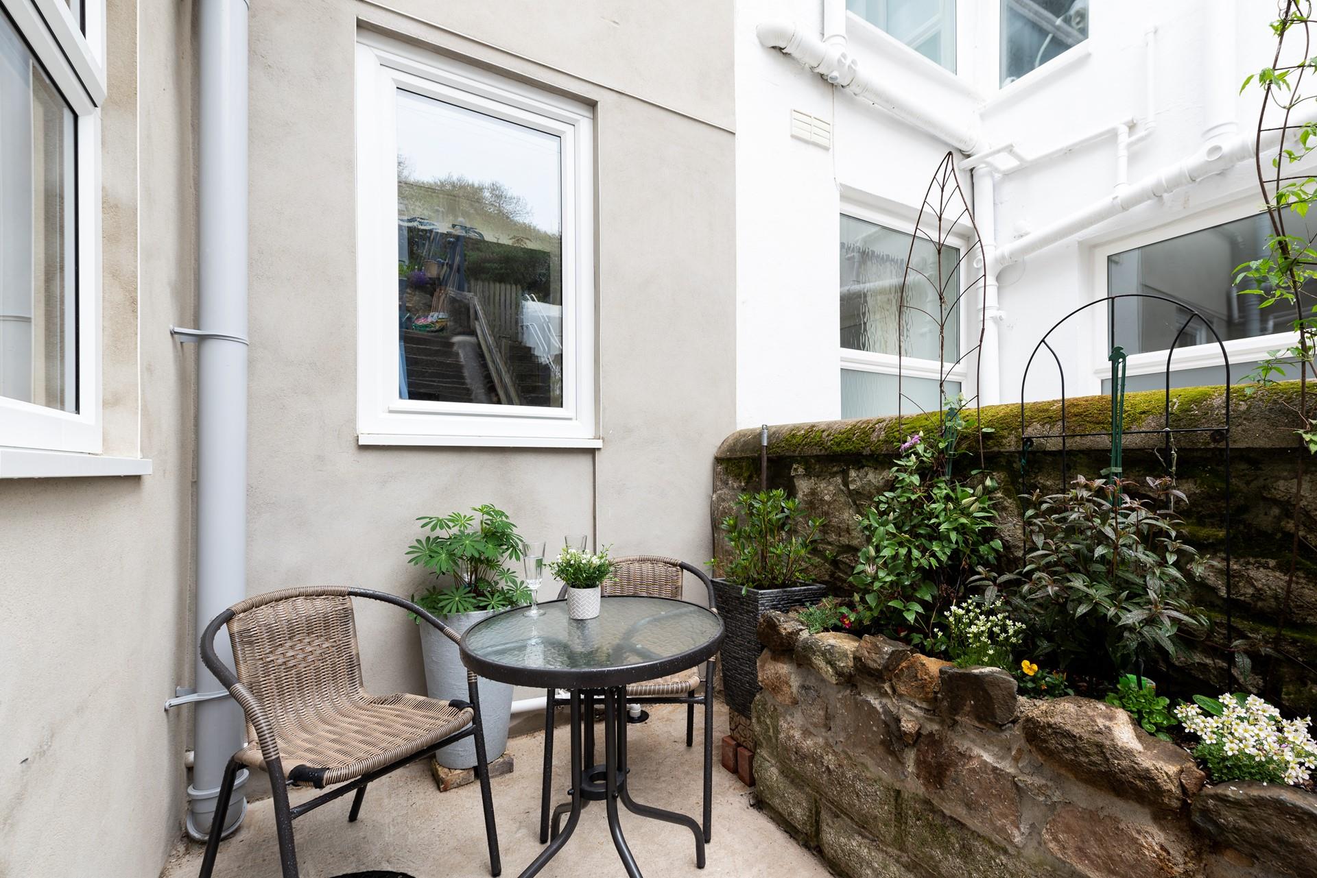 The rear courtyard is perfect mid-morning and is a real sun trap. 