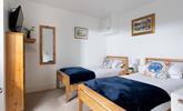 Suitable for children or friends, bedroom 2 offers twin beds and access to the rear courtyard. - Thumbnail Image
