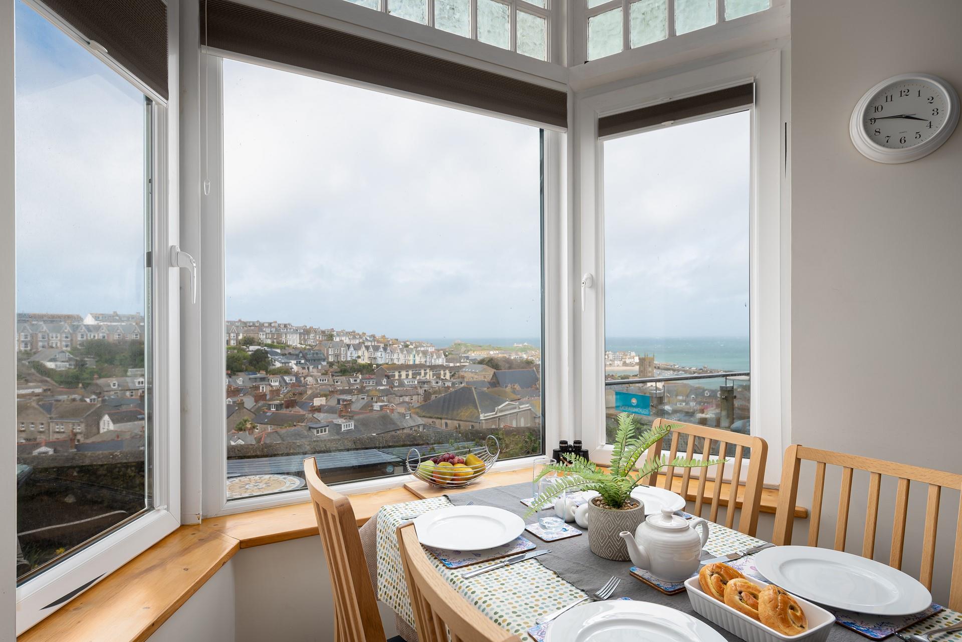 The views from the dining table are stunning; overlooking Smeaton's Pier and stretching out beyond Godrevy Lighthouse.